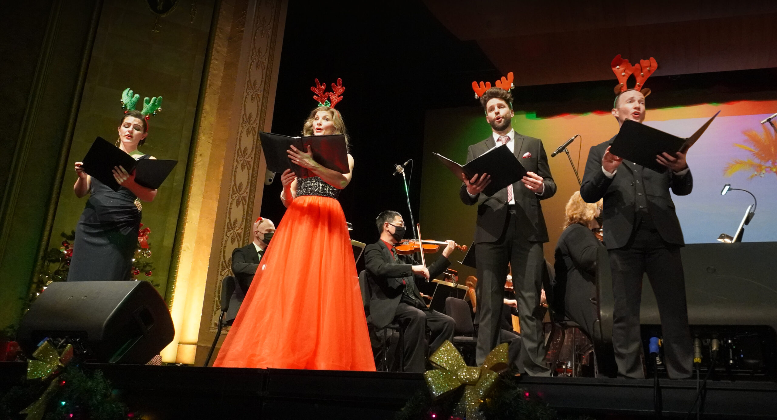 Photo of Windsor Symphony Orchestra singers singing on stage.